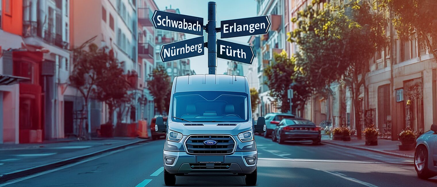 Ein Auto steht auf einer Straße. Hinter ihm Richtungsschilder nach Erlangen, Fürth, Schwabach und Nürnberg. 